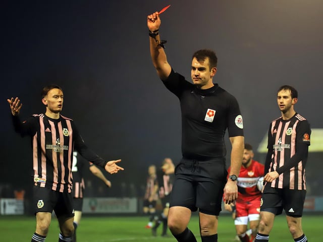The referee shows a red card to Curzon Ashton's Matthew Challoner