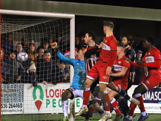 George Cooper heads home Kettering's third goal