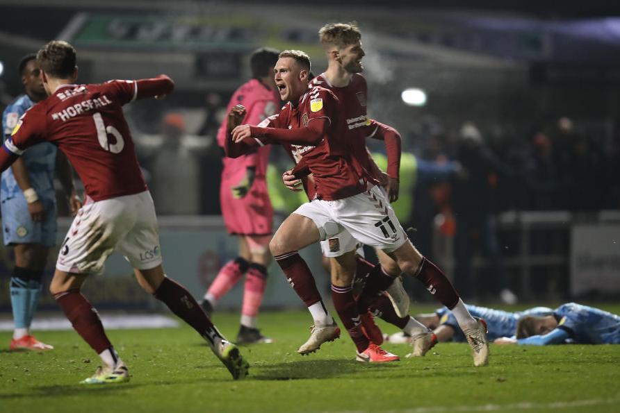 Mitch Pinnock's thunderous equaliser sparked scenes of mayhem all around Sixfields. Pictures: Pete Norton.