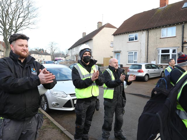 The workers on the project were filmed as they clapped the family