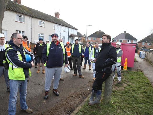 Nick Knowles chats to volunteers in the street as the Big Build begins