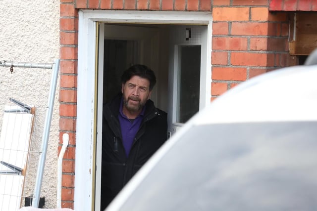 Nick Knowles in the doorway of the house that is to be transformed in a week by volunteers