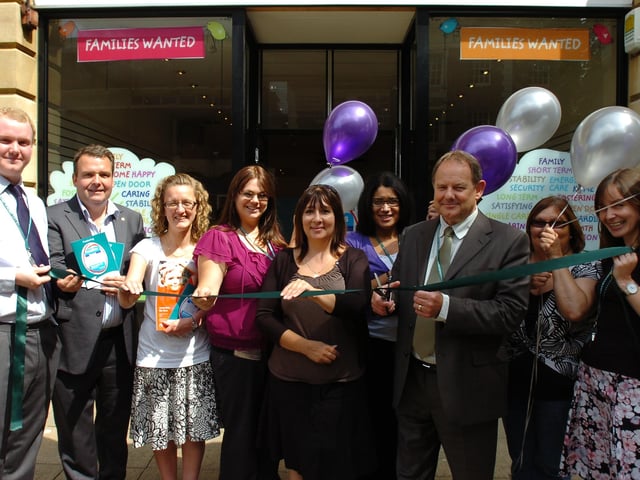 Director of Children's services at PCC John Richards opeing the Fostering shop at Bridge street. He is pictured with staff and city council representatives