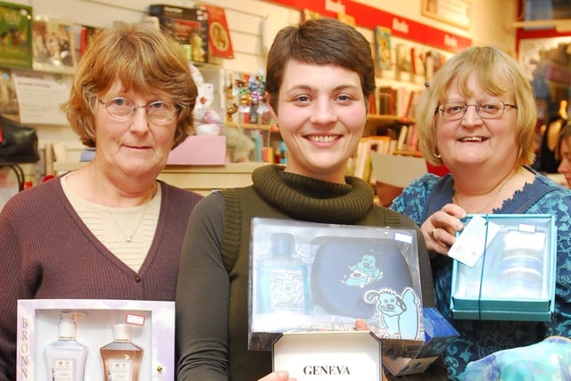 British Heart Foundation shop staff Sylvia Weeks, Susie Claridge and Elizabeth George (manager) on Bridge Street, Peterborough pictured with some new items (probably unwanted Christmas gifts) which have been donated by the public.