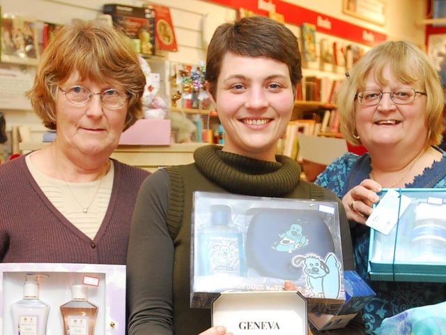 British Heart Foundation shop staff Sylvia Weeks, Susie Claridge and Elizabeth George (manager) on Bridge Street, Peterborough pictured with some new items (probably unwanted Christmas gifts) which have been donated by the public.