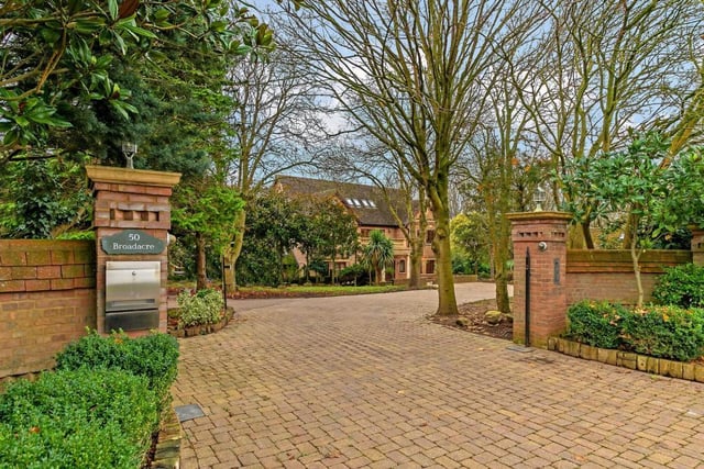 The property has a gated entrance, sits on a 1.89 acre plot with stunning views towards Linford Lakes.
