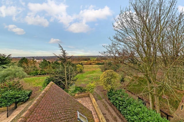 The property is located on a 1.89 acre plot with stunning views towards Linford Lakes.