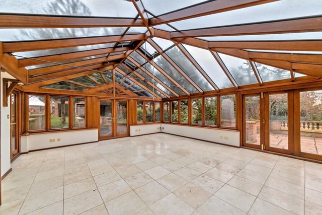 The conservatory measures  6.86m x 6.07m with double glazed construction, glazed roof, tiled flooring, three double doors and bi-fold door to garden.