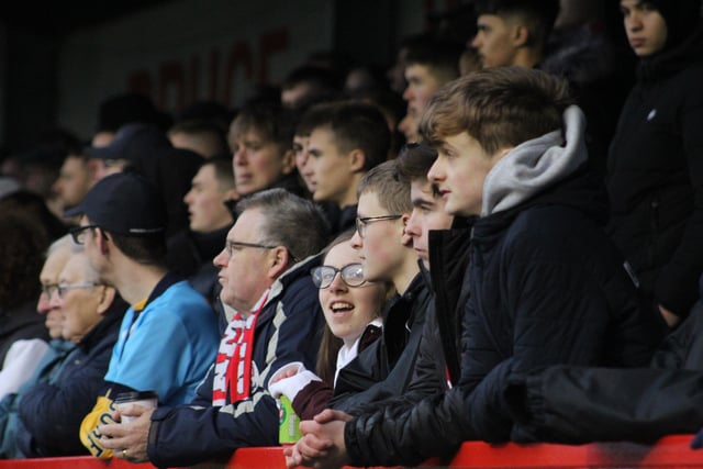 Reds fans watch on. Crawley Town v Tranmere Rovers. Pictures by Cory Pickford SUS-220122-163619004
