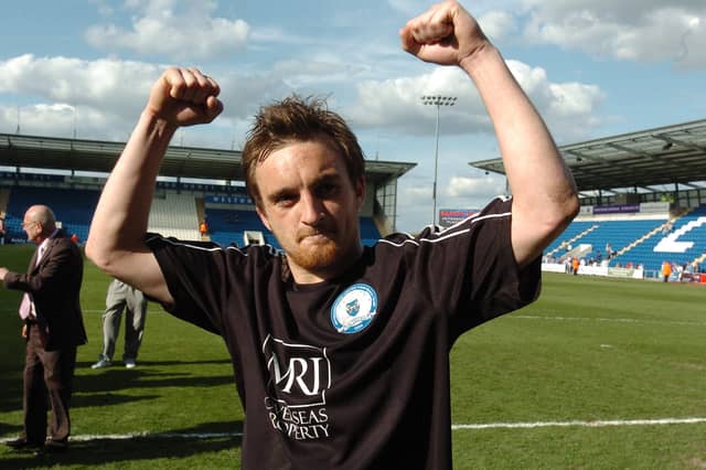 Posh hero Charlie Lee celebrates promotion to the Championship in April, 2009.
