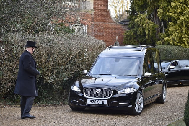 The hearse leaving his home at Thorpe Road.
