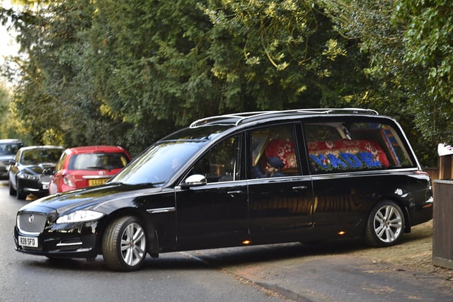The hearse leaving his home at Thorpe Road.