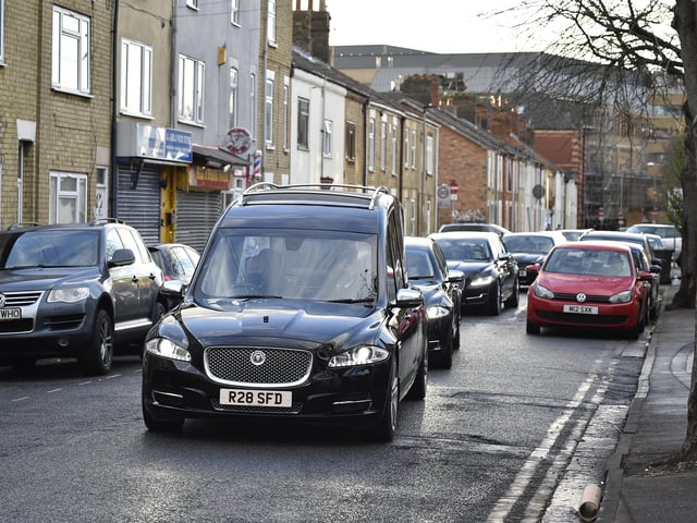 The hearse passing his former shop on Cromwell Road.