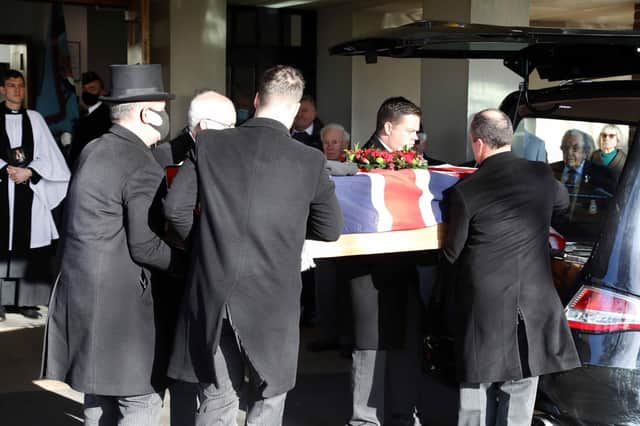 Reg's service cap and scarf were place on his coffin, draped with the Union flag