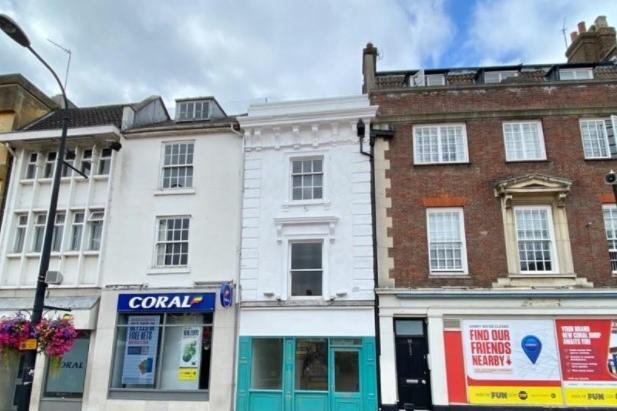 The three-storey property between Coral and Ladbrokes is up for sale at £350,000. The sale advert reads: "The accommodation comprises a ground floor shop over basement storage with three floors of offices above. Tidy WC and well fitted kitchen. A rare opportunity to acquire a freehold shop / office in the heart of Northampton Town Centre."