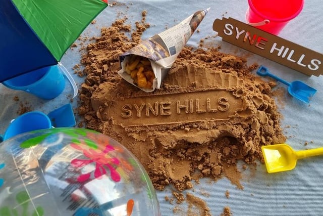 Syne Hills written in sand.