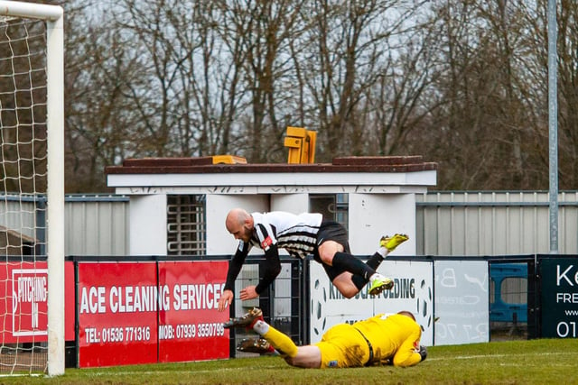 James Clifton takes a tumble over visiting goalkeeper Ross Durrant
