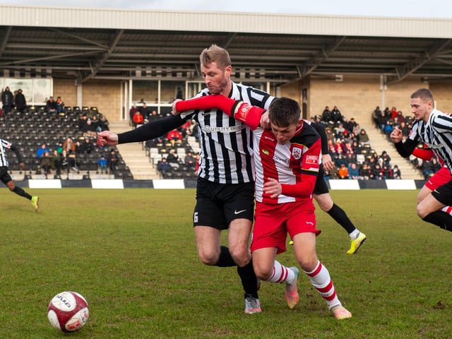 Steelmen captain Gary Mulligan battles for possession