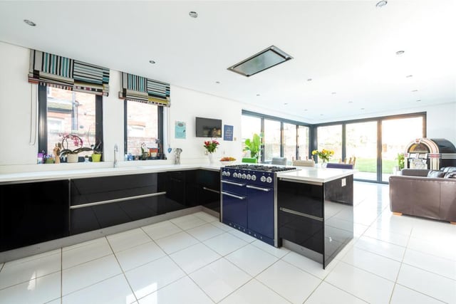 The kitchen/breakfast/dining room is a major feature of the property. The kitchen is fitted in a contemporary style range of high gloss units with Corian work surfaces and space for a variety of appliances