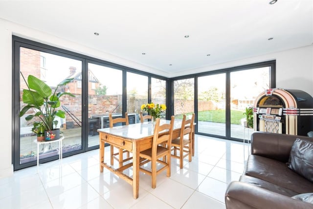 The dining room has dual aspect bi-fold doors extending the room out to the garden