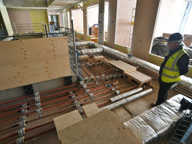 The pipes and wires that will sit under ground storey flooring. EMN-220214-144830009