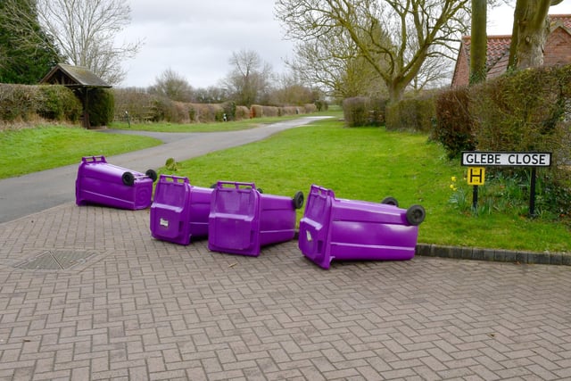 NKDC rubbish collectors were instructed to lay down emptied bins on their rounds today, such as here at Scopwick. EMN-220218-155228001