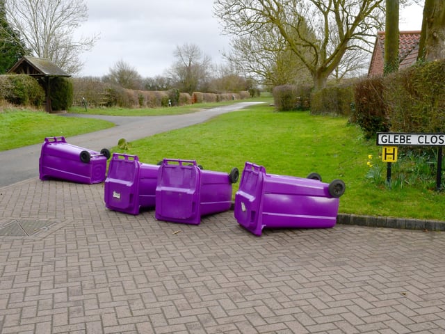NKDC rubbish collectors were instructed to lay down emptied bins on their rounds today, such as here at Scopwick. EMN-220218-155228001