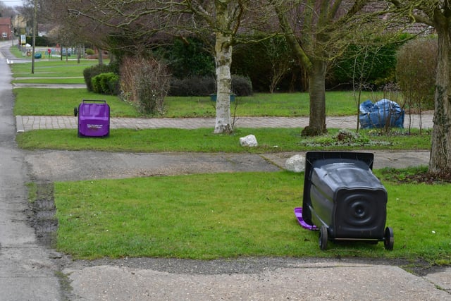 NKDC rubbish collectors were instructed to lay down emptied bins on their rounds today, such as here at Metheringham EMN-220218-155246001