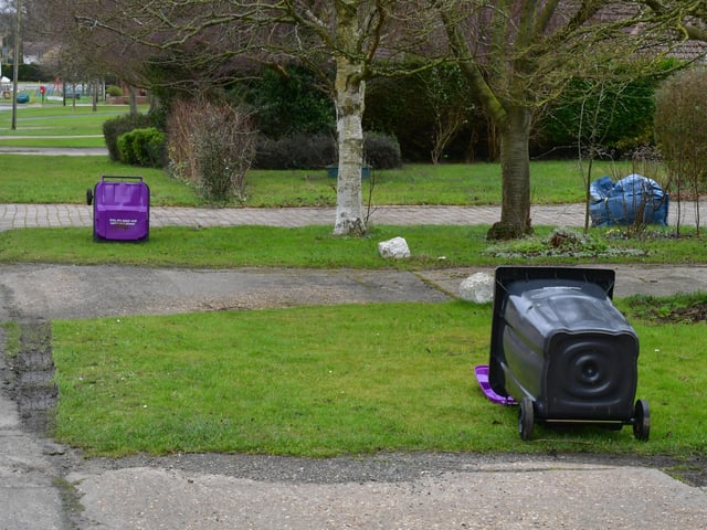 NKDC rubbish collectors were instructed to lay down emptied bins on their rounds today, such as here at Metheringham EMN-220218-155246001