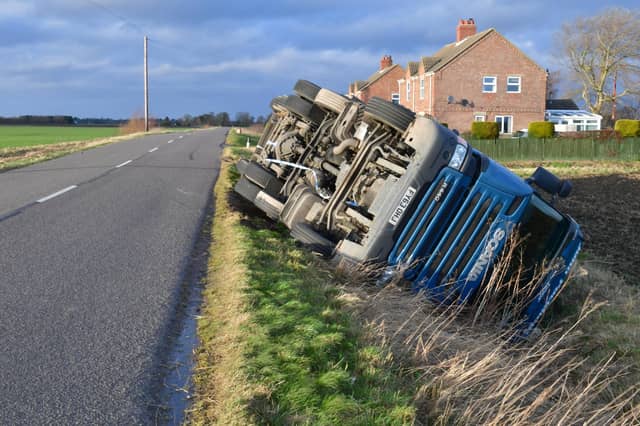 Overturned lorry at South Kyme in the high winds of Storm Eunice. EMN-220218-181814001