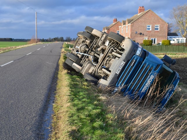 Overturned lorry at South Kyme in the high winds of Storm Eunice. EMN-220218-181814001