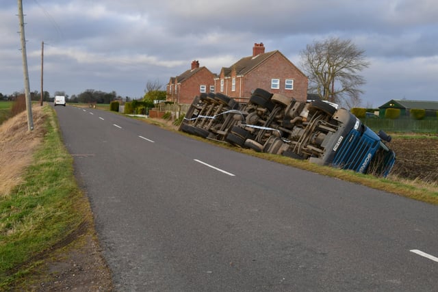 Overturned lorry at South Kyme in the high winds of Storm Eunice. EMN-220218-181737001