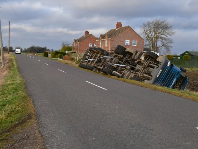Overturned lorry at South Kyme in the high winds of Storm Eunice. EMN-220218-181737001