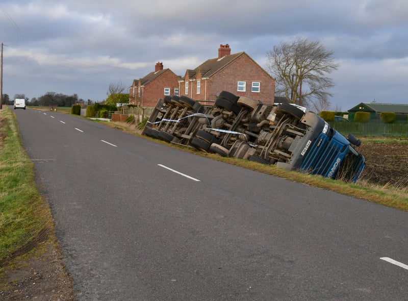Overturned lorry at South Kyme in the high winds of Storm Eunice. EMN-220218-181737001