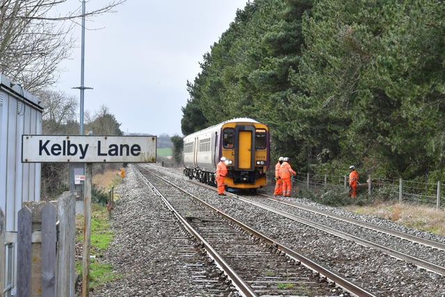Engineers work to clear a fallen tree on the railway line at Kelby Lane crossing, between Sleaford and Ancaster. EMN-220218-181909001