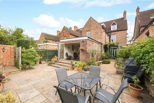 A gated side access leads to the rear garden which has a paved outdoor entertaining area which continues to the side of the house where it is covered by a glazed gazebo for year round use