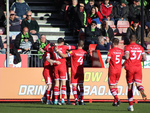 Players celebrate Tunnicliffe's goal. Crawley Town v Forest Green Rovers. Picture by Cory Pickford SUS-220226-174613004
