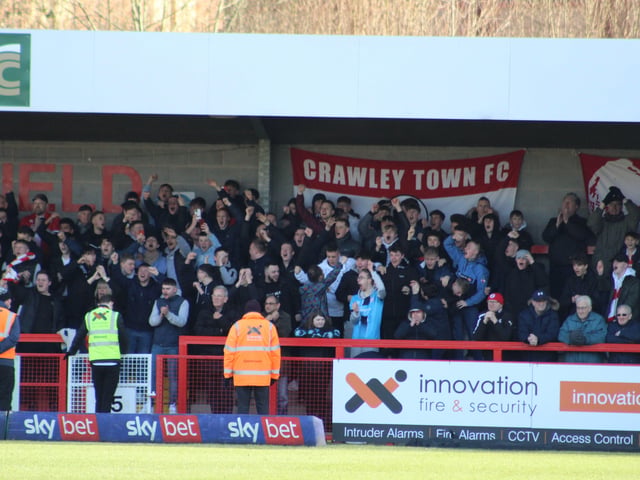 Reds fans celebrate. Crawley Town v Forest Green Rovers. Picture by Cory Pickford SUS-220226-174632004