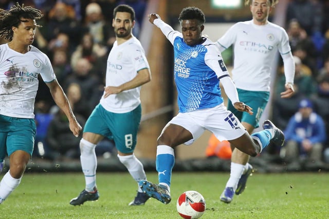 Posh forward Kwame Poku shoots at the Manchester City goal.