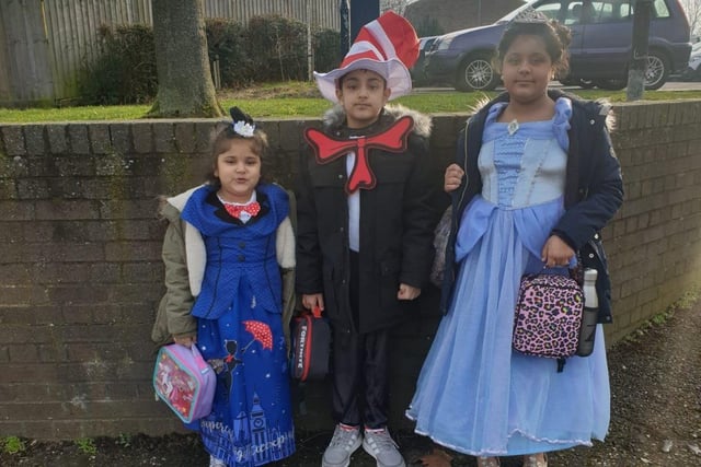 Madiha, aged five, dressed as Mary Poppins with Suhaan, nine, as the Cat in the Hat and Zoya, ten, as Cinderella on their way to Lime Academy in Watergale this morning.
