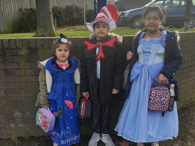 Madiha, aged five, dressed as Mary Poppins with Suhaan, nine, as the Cat in the Hat and Zoya, ten, as Cinderella on their way to Lime Academy in Watergale this morning.