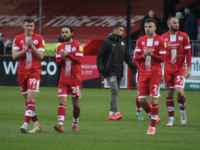 Players at the end of the game. Crawley Town v Scunthorpe United. Picture by Cory Pickford SUS-220503-184426004