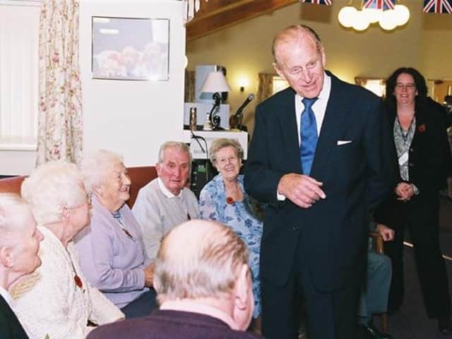 Prince Philip talking to residents at Carey House