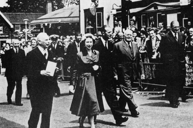 The Queen and Prince Philip walking down the old Hight Street in 1958
