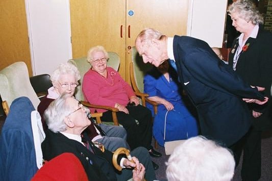 Prince Philip talking to Carey House residents