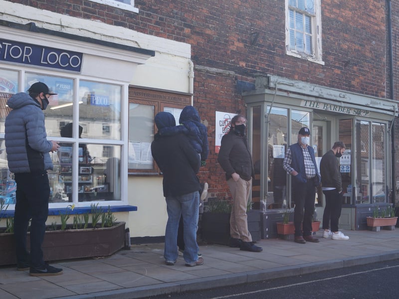 Pateintly waiting oustide Caistor's The Barber Shop EMN-211204-133426001