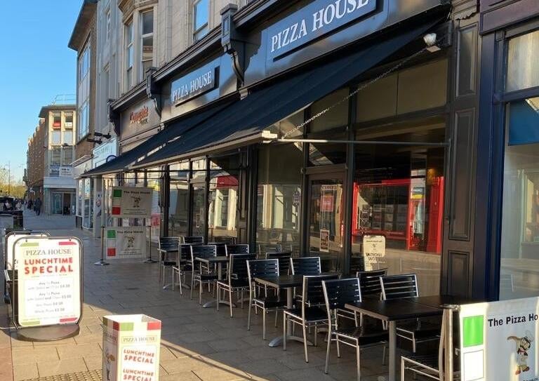 Outside the Pizza House in the city centre