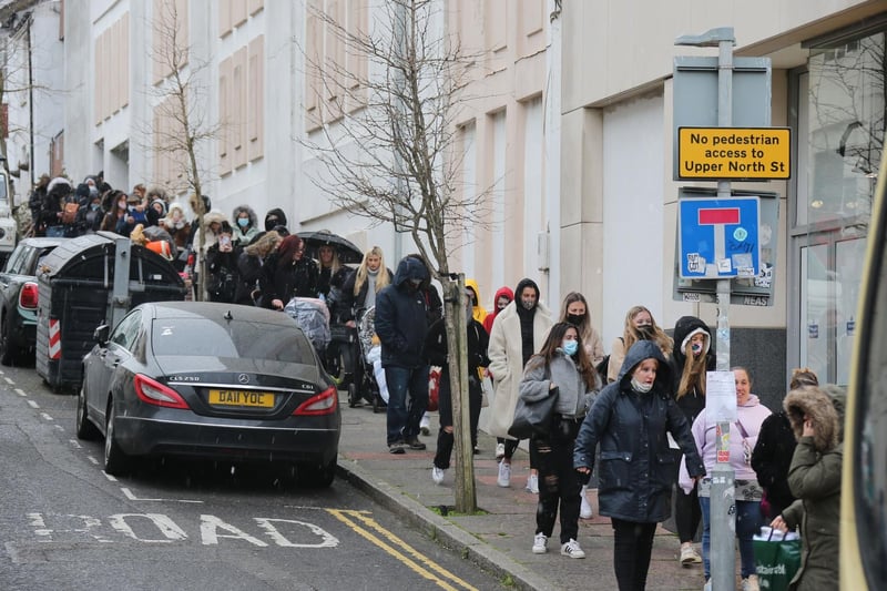 People queuing up the road for Primark