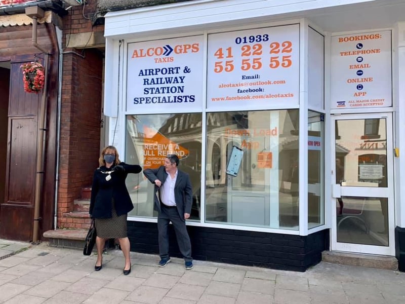 The mayor outside the taxi firm's newly refurbished premises