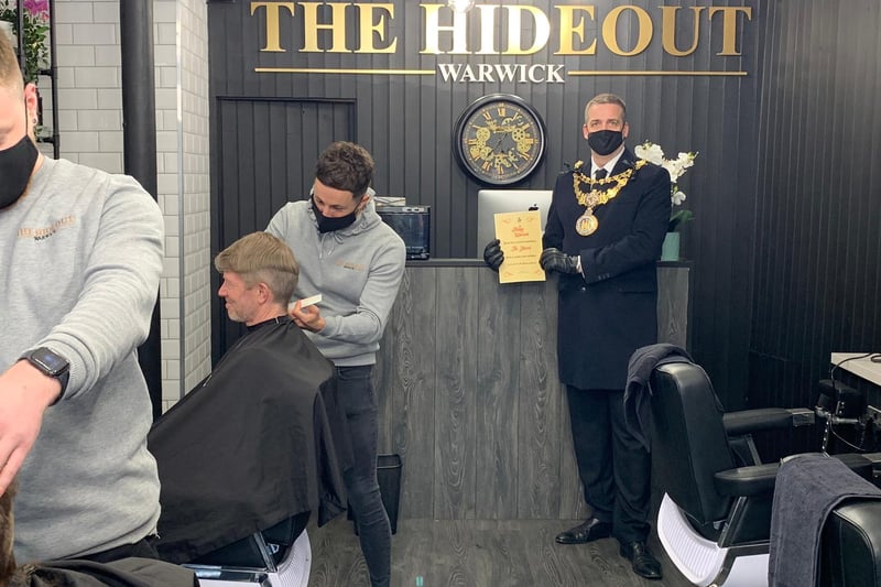 People can now finally get their haircut. Pictured here is the Mayor of Warwick, Cllr Terry Morris at The Hideout in Warwick. He went to various businesses across the town to celebrate the reopenings.